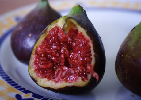 juicy fig cut open on plate