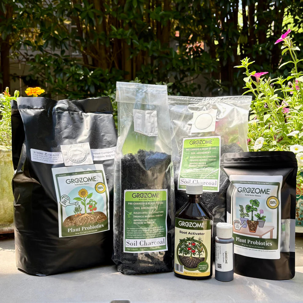 Grozome gardening products including bags, bottles, and containers on a table outdoors.
